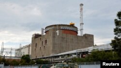  Фото: російська броньована машина поблизу Запорізької АЕС, 1 вересня 2022 року. REUTERS/Alexander Ermochenko