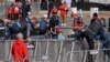 Polisi wakifanya uchunguzi kufuatia ufyatuaji wa risasi wakati mabingwa wa Super Bowl, Kansas Chiefs walikuwa wakisherekea ushindi katika mji wa Kansas, Februari 14, 2024. Picha ya AP