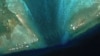 中国在南中国海争议浅滩潟湖入口处安放新的浮动障碍