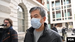 英国警方起诉三名男子，指他们违反当地《国家安全法》，星期一出庭应讯的其中一名被告，香港驻伦敦经济贸易办事处行政经理袁松彪 (Chung Biu Yuen)，又名Bill Yuen (摄影：Galileo Cheng)