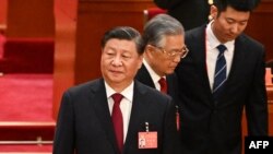 中共领导人习近平和前领导人胡锦涛在北京人大会堂出席中共二十大开幕式。（2022年10月16日）