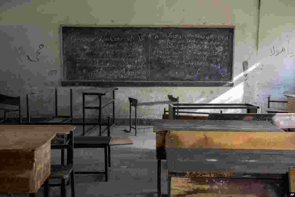 A classroom that previously was used for girls sits empty in Kabul, Afghanistan, Dec. 22, 2022. The country's Taliban rulers earlier this week ordered women nationwide to stop attending private and public universities effective immediately and until further notice. They have banned girls from middle school and high school, barred women from most fields of employment and ordered them to wear head-to-toe clothing in public. Women are also banned from parks and gyms.