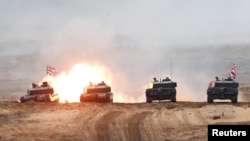 Британські танки під час навчань НАТО у Латвії, 11 жовтня 2019. REUTERS/Ints Kalnins