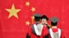 资料照：上海复旦大学的毕业生在毕业典礼上。