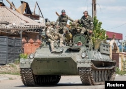 Російські війська у Маріуполі, 11 травня 2022. REUTERS/Alexander Ermochenko