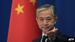 资料照-中国外交部发言人汪文斌在一场记者会上