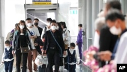 资料照片：中国游客抵达泰国国际机场。（2023年1月9日）