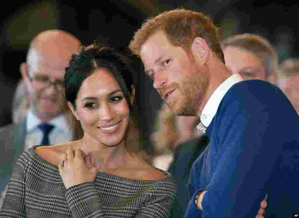 Britain's Prince Harry and Meghan Markle watch a dance performance by Jukebox Collective Cardiff Castle in Cardiff, Wales.