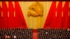 FILE - Chinese President Xi Jinping, front row center, stands with his cadres during the Communist song at the closing ceremony for the 19th Party Congress at the Great Hall of the People in Beijing on Oct. 24, 2017.