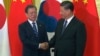 中国国家主席习近平在北京人大会堂会见到访的韩国总统文在寅。（2019年12月23日）