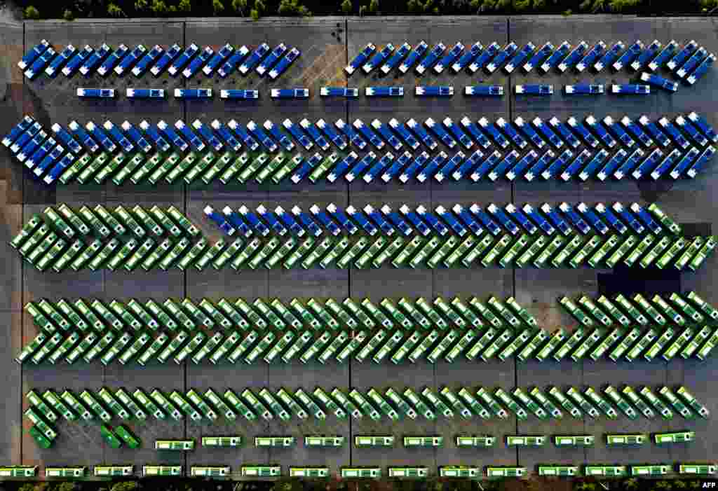 An aerial view shows city buses parked in the bus depot following the suspension of public transport services amid concerns over the spread of the Covid-19 pandemic in Tbilisi, Georgia.