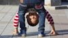 FILE - A child bends over in a public park in Yinchuan in northwestern China's Ningxia Hui autonomous region, Oct. 8, 2015. China this week officially ended its three-decade old one-child policy.