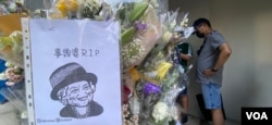 有香港市民画卡通版女皇头像，以港人独有的“事头婆“（老板娘）称呼愿她安息 (美国之音/汤慧云)