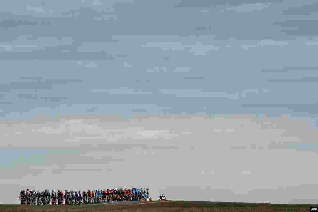 The pack rides through the countryside during the second stage of the Paris - Nice cycling race between Orsonville and Vierzon, France.