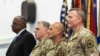 Міністр оборони США Ллойд Дж. Остін, голова Об’єднаного комітету начальників штабів США генерал Марк А. Міллі, генерал армії США Крістофер Г. Каволі під час церемонії зміни Європейського командування США в Штутгарті, Німеччина. Фото армії США сержанта Патріка Оркатта