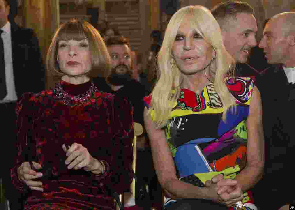 Designer Donatella Versace and Vogue Editor-in-Chief Anna Wintour, left, sit at Palazzo Colonna in Rome, Italy. The Vatican loaned some of its most beautiful liturgical vestments, jeweled miter caps and historic papal tiaras for an upcoming exhibit on Catholic influences in fashion at the Metropolitan Museum of Art.