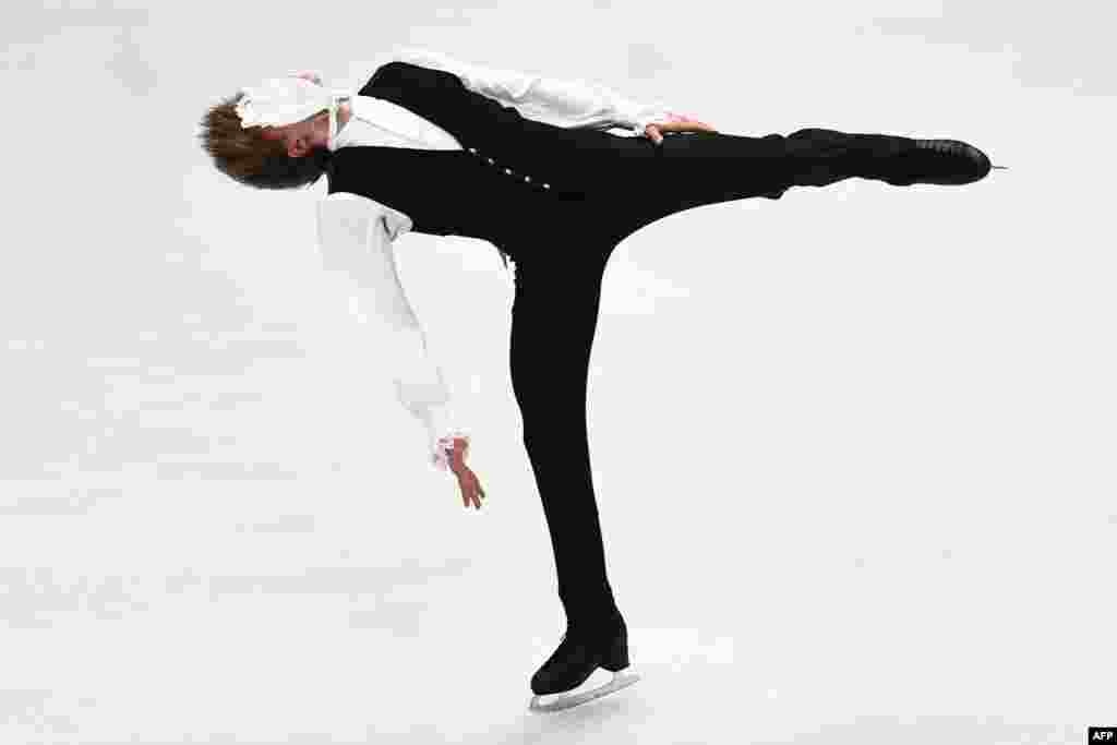 Latvia's Deniss Vasiljevs performs during the men's short program at the World Figure Skating Championship in Milan, Italy.