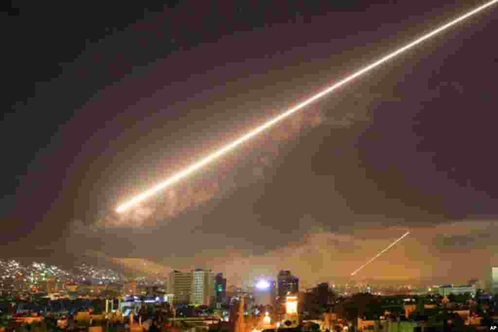 Damascus skies erupt with surface to air missile fire as the U.S. launches an attack on Syria targeting different parts of the Syrian capital Damascus, April 14, 2018. Syria&#39;s capital has been rocked by loud explosions that lit up the sky with heavy smoke as U.S. President Donald Trump announced airstrikes in retaliation for the country&#39;s alleged use of chemical weapons.