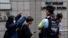香港民主党承压，亲北京媒体高调喊话促解散