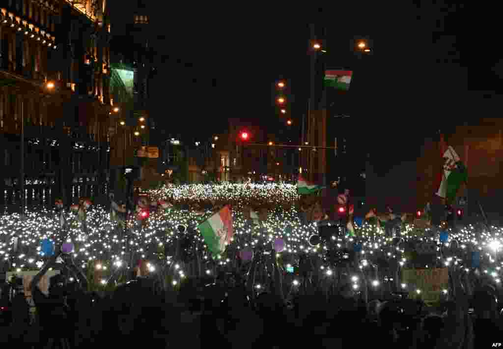 Protesters take part in an anti-government demonstration in Budapest, Hungary, April 21, 2018. Tens of thousands of Hungarians took to the streets in Budapest for a second consecutive Saturday to protest against newly reelected Prime Minister Viktor Orban.