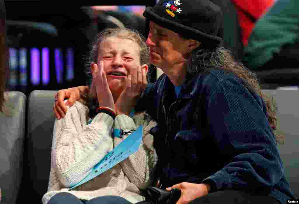 Anita Beroza of Belmont, California, is comforted after she was eliminated from the Scripps National Spelling Bee at National Harbor in Maryland, May 30, 2018.