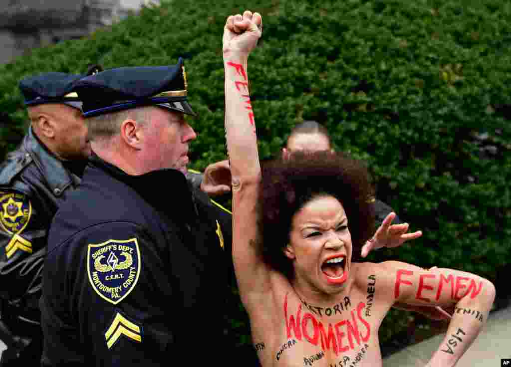 Actress Nicolle Rochelle, who appeared on several episodes of "The Cosby Show," is detained as Bill Cosby arrives for his sexual assault trial at the Montgomery County Courthouse, in Norristown, Pennsylvania.