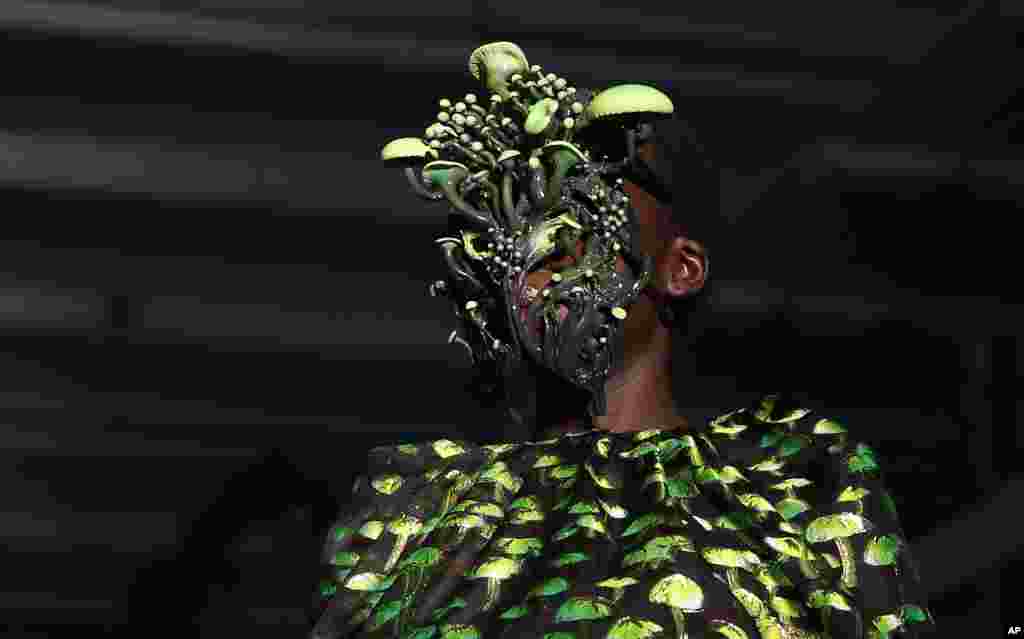 A model wears a creation as part of the Daniel Del Core women's and men's Fall Winter 2021-22 collection during the Fashion Week in Milan, Italy.