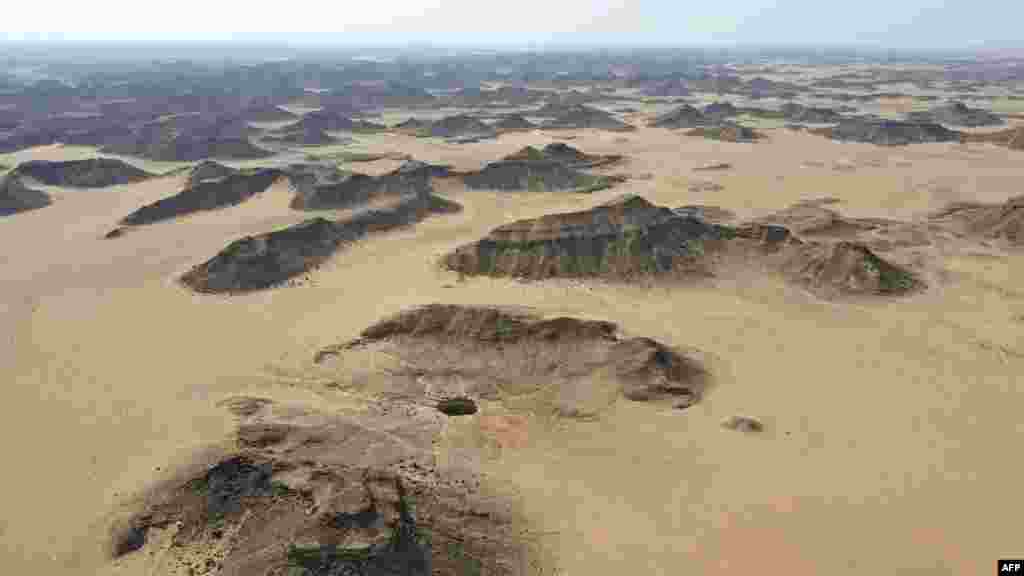 An aerial view shows the Well of Barhout known as the "Well of Hell" in the desert of Yemen's Al-Mahra province.