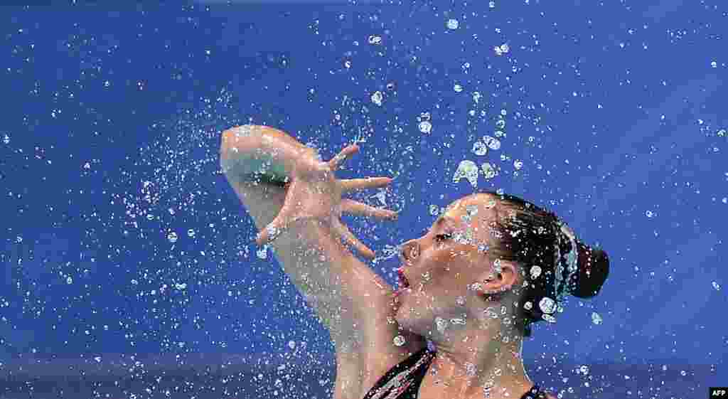 Israel's Polina Prikazchikova competes in the final of the Solo Free Artistic Swimming event during the LEN European Aquatics Championships at the Duna Arena in Budapest, Hungary.