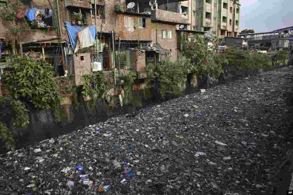 Garbage chokes a polluted canal in Mumbai, India. The theme for this year's World Environment Day, marked on June 5, is "Beat Plastic Pollution."