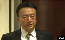 北大教授贾庆国在华盛顿一个智库的研讨会上(2014年4月19日,美国之音黎堡拍摄)