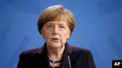 German Chancellor Angela Merkel addresses the media during a statement at the Chancellery in Berlin, Germany, March 24, 2015, after a Germanwings passenger jet carrying more than 140 people crashed in the French Alps.