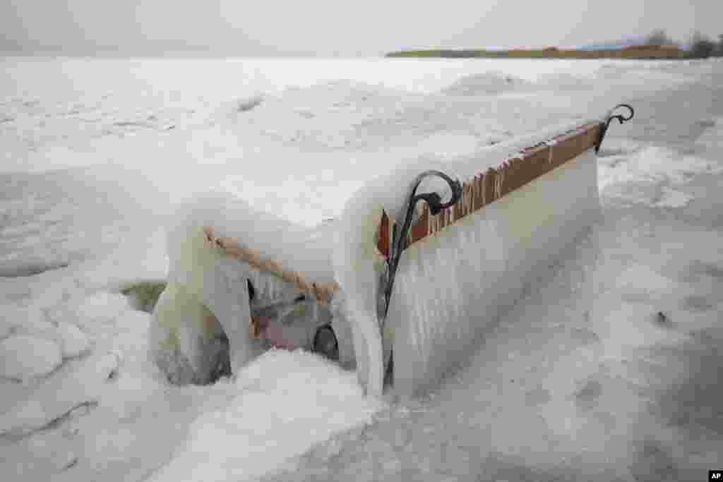 Ice covers a bench on the shore of Lake Balaton in Balatonfenyves, 155 kms southwest of Budapest, Hungary, as extreme cold strengthened by high winds chills most of the country.