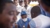 Nurses working with the World Health Organization (WHO) prepare to administer vaccines at the town all of Mbandaka on May 21, 2018 during the launch of the Ebola vaccination campaign.