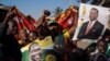 Supporters of the newly elected Zimbabwe President Emmerson Mnangagwa celebrate in Mbare, Harare, Aug. 3, 2018. Mnangagwa, a former ally of Robert Mugabe, won 50.8 percent of the vote, ahead of Nelson Chamisa of the opposition MDC party at 44.3 percent, the Zimbabwe Electoral Commission (ZEC) said.