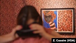 Toybox founder Arlene Mulder views a project that their tech innovation hub was involved in, a Virtual Reality exhibition at a Johannesburg art gallery.