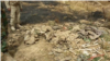 A mass grave in Sinjar, Iraq, believed to contain the remains of Yazidi members massacred by IS two years ago, is seen after a fire broke out in early June, 2016.
