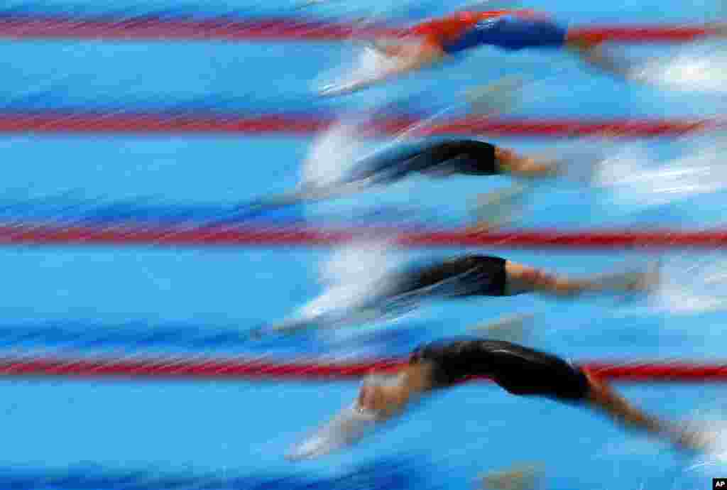 Athletes start into the women's 50-meter breaststroke preliminaries at the European Aquatics Championships in Duna Arena in Budapest, Hungary.