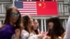 In this Thursday, Sept. 24, 2015, photo, China's flag is displayed next to the American flag on the side of the Old Executive Office Building on the White House complex in Washington.