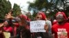 FILE - Opposition supporters march on the streets of Harare, Zimbabwe, June, 5, 2018.