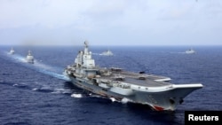 资料照：2018年4月18日，中国航母辽宁号参加中国海军在西太平洋的军事演习。