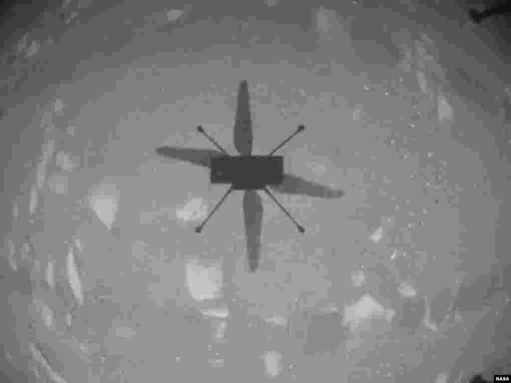 NASA’s Ingenuity Mars Helicopter captured this shot as it hovered over the Martian surface during the first instance of powered, controlled flight on another planet. (NASA/JPL-Caltech)
