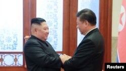 金正恩2019年1月10日在北京会见习近平。