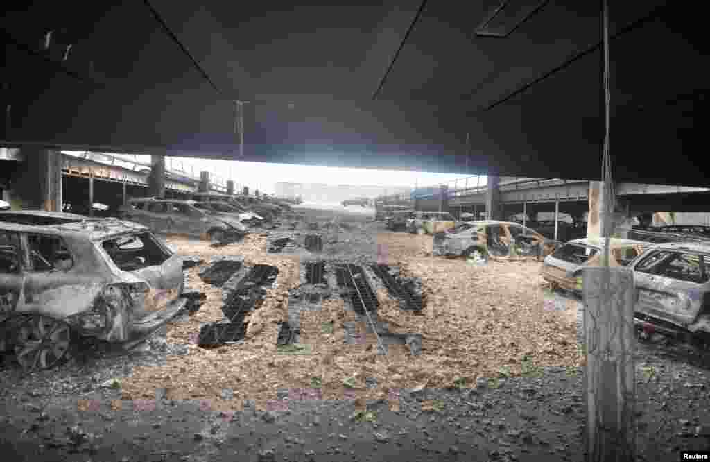Burnt cars are seen in what remains of the multi-story car park, where a large fire destroyed many cars on Sunday, in King's Dock, Liverpool, Britain, Jan. 01, 2018.