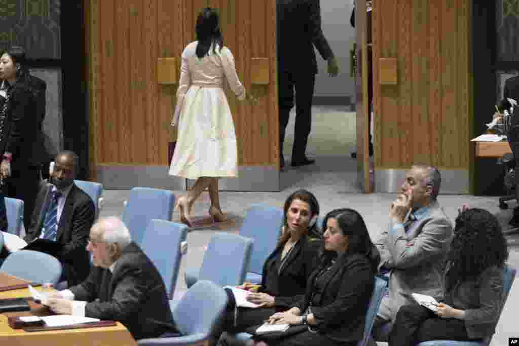 U.S. Ambassador to the United Nations Nikki Haley, top center, leaves the room as Palestinian Ambassador to the United Nations Riyad Mansour, right, prepares to address a Security Council meeting on the situation in Gaza, at United Nations headquarters in New York.