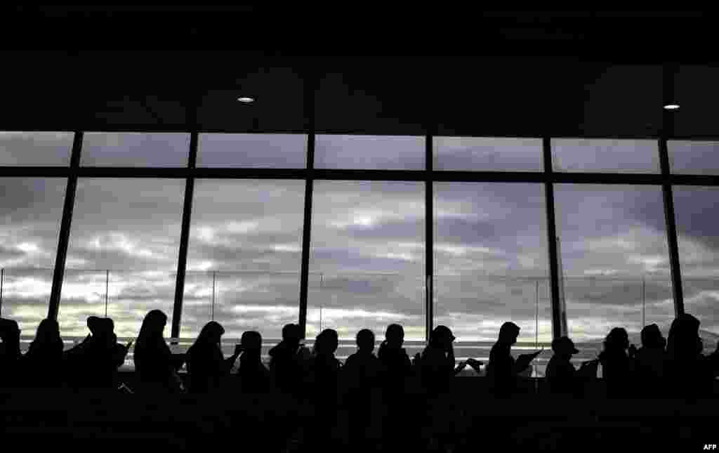 Filipina workers returning home from Kuwait arrive at Manila International Airport. After a horrific murder of a Philippine maid in Kuwait, hundreds of women are now streaming back home, recounting their abuse and hardship-- but also saying they are ready to work abroad again.