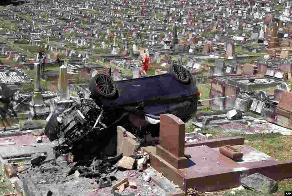 A Mercedes SUV lies on the gravestones at a cemetery in the Sydney suburb of South Coogee, Australia. The early morning crash caused significant damage after the driver failed to take a corner, crashing through a wall before landing on the gravestones. Police said the driver failed a roadside alcohol breath test before going to hospital.