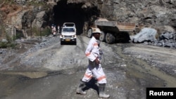FILE - A worker is pictured at the entrance of a mine in Bindura town, Zambia, Feb. 7, 2015.