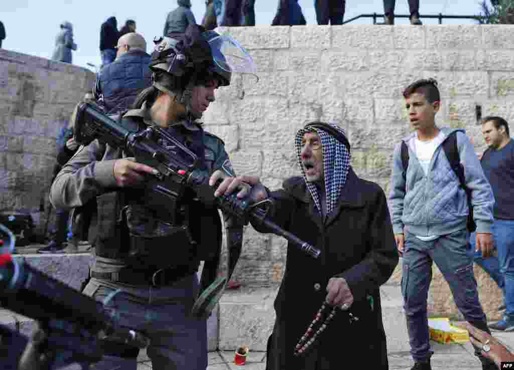 Israeli forces disperse Palestinian protestors outside Damascus Gate in Jerusalem's Old City.