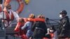 A Border Force vessel brings a group of people thought to be migrants into the port city of Dover, England, from small boats, Aug. 8, 2020.